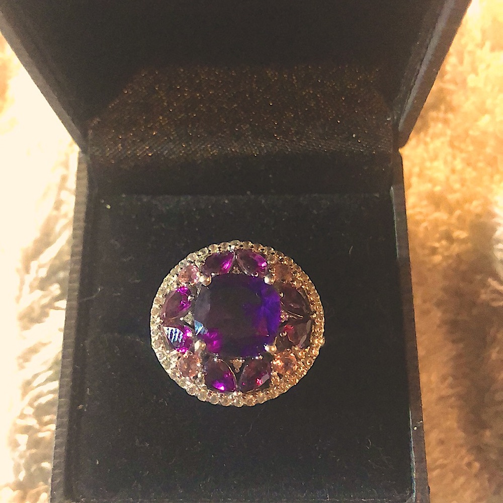 Purple gemstones and diamonds set in sterling silver. Size 7.